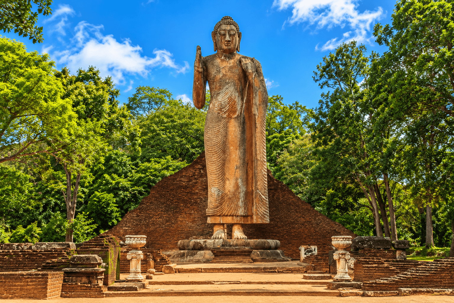 Ancient limestone Maligawila Buddha statue landmark near Buttala